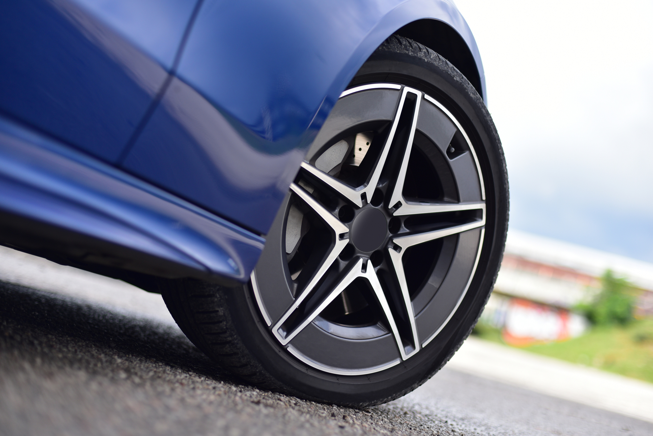Close up of a tire on a blue car